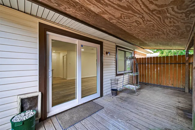 a view of outdoor space with wooden floor