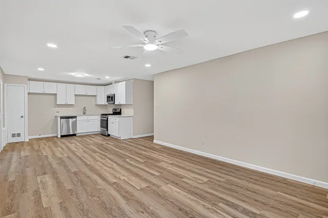 a view of kitchen with wooden floor
