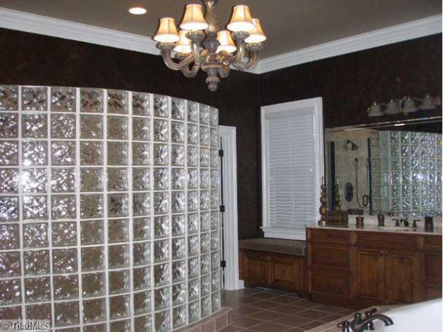 1045 Rockford Road High Point, NC 27262 - Photo 11 of 16 Master Bath/Spa. "To Die For" master bath. Huge glass block shower and separate steam shower. Two vaniites, jetted tub and gracious closets.