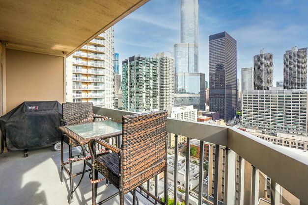 545 North Dearborn Street, Unit 2510 Chicago, IL 60654 - Photo 18 of 22 a view of a balcony dining area with furniture