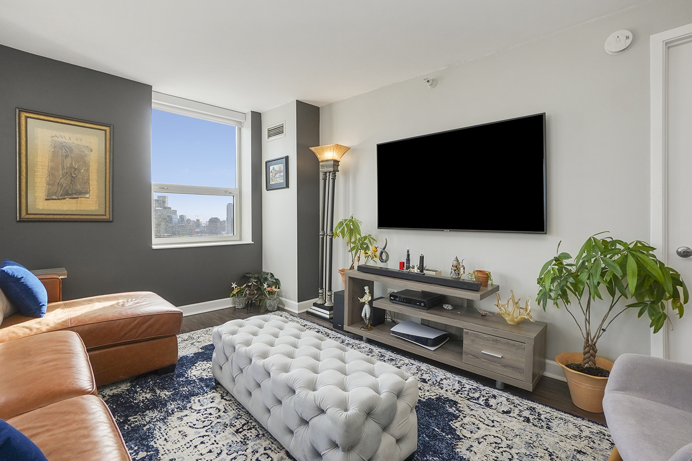 545 North Dearborn Street, Unit 2510 Chicago, IL 60654 - Photo 4 of 22 a living room with furniture and a flat screen tv