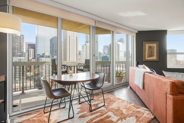 545 North Dearborn Street, Unit 2510 Chicago, IL 60654 - Photo 5 of 22 a living room with furniture and a window