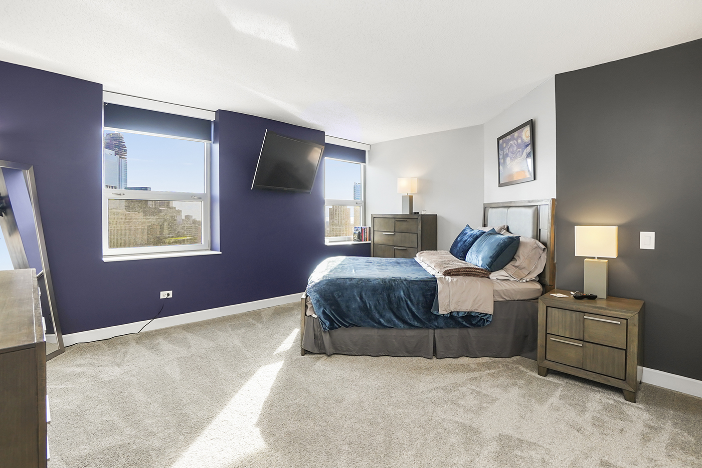 545 North Dearborn Street, Unit 2510 Chicago, IL 60654 - Photo 10 of 22 a bedroom with a bed and dresser