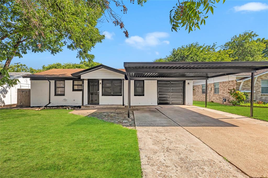 front view of a house with a yard