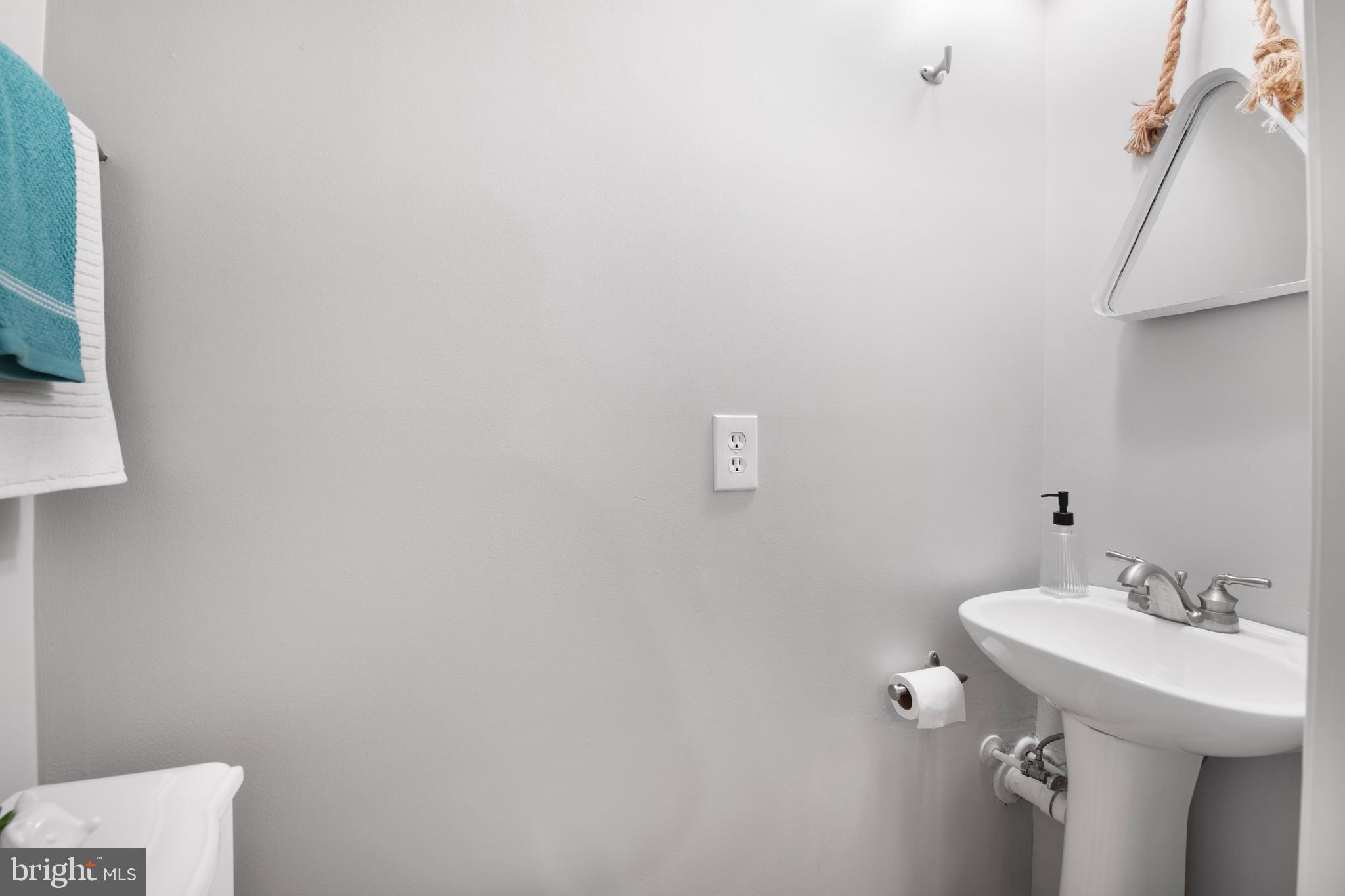 903 R Street Northwest, Unit 1 Washington, DC 20001 - Photo 15 of 32 a bathroom with a sink and mirror