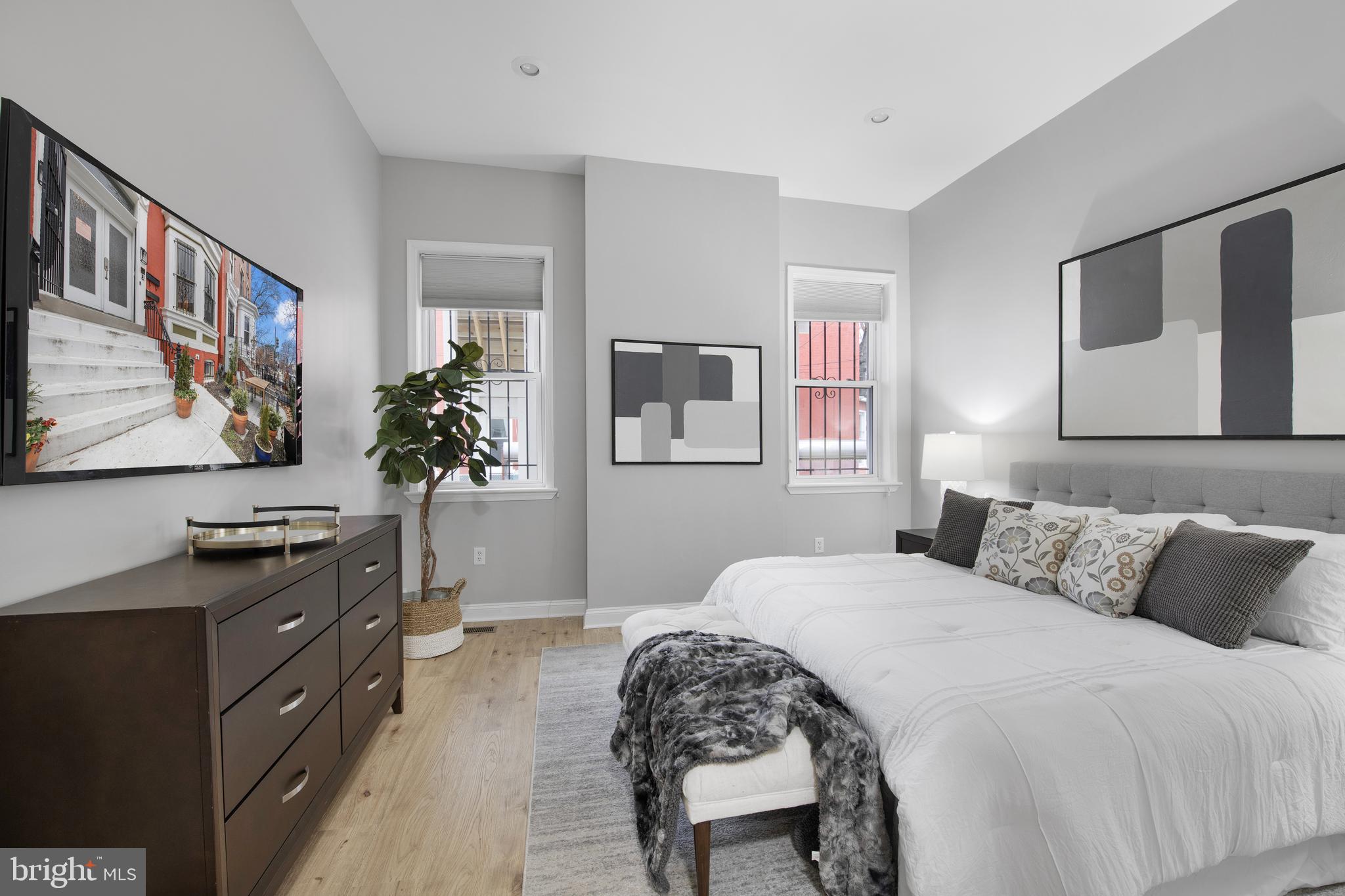903 R Street Northwest, Unit 1 Washington, DC 20001 - Photo 16 of 32 a bedroom with a bed and a flat screen tv
