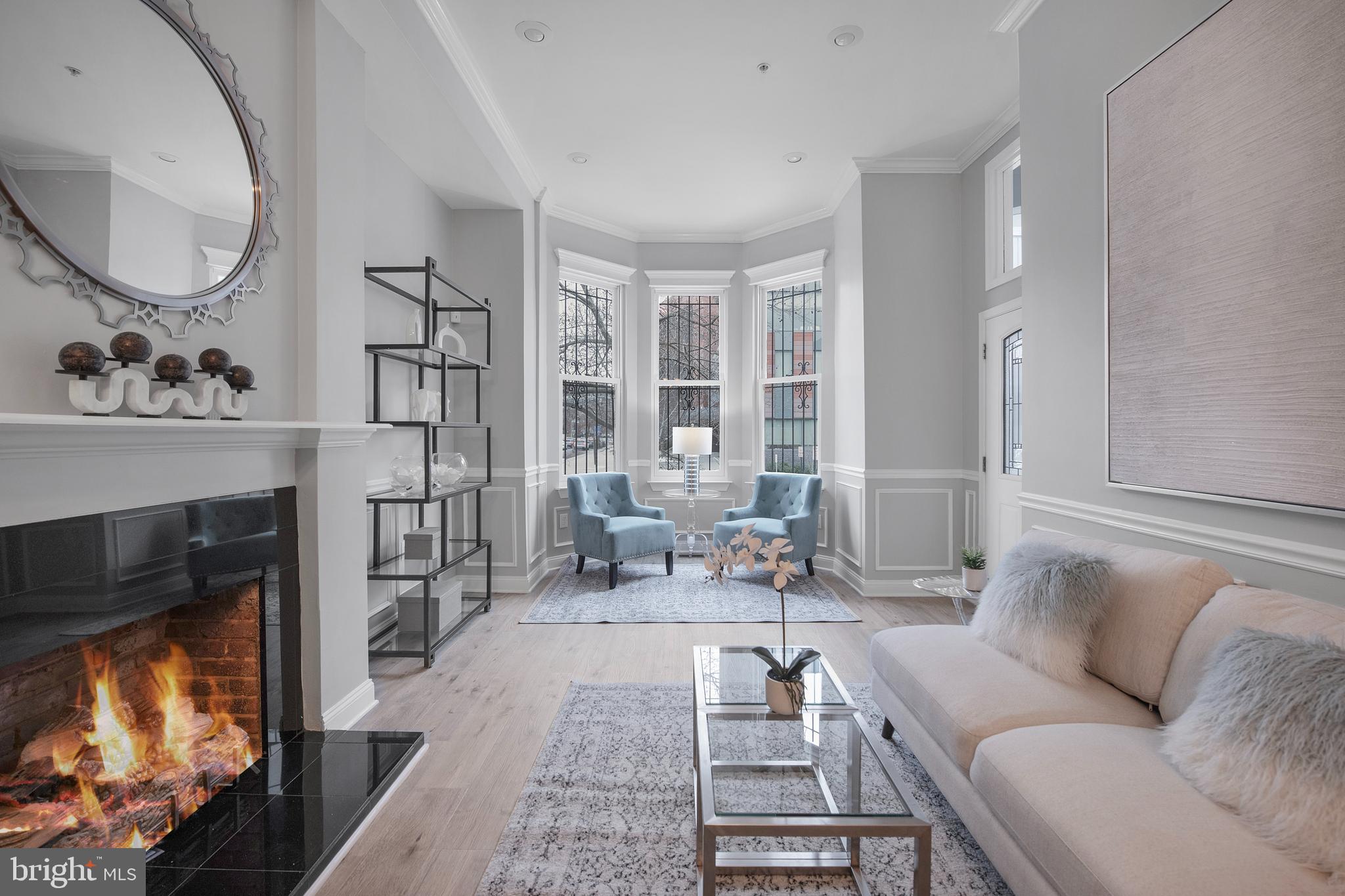 903 R Street Northwest, Unit 1 Washington, DC 20001 - Photo 2 of 32 a living room with furniture and a fireplace