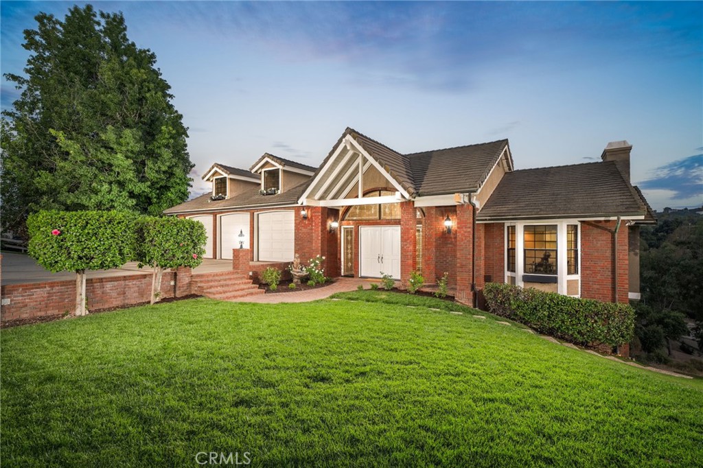 a front view of a house with a yard and porch