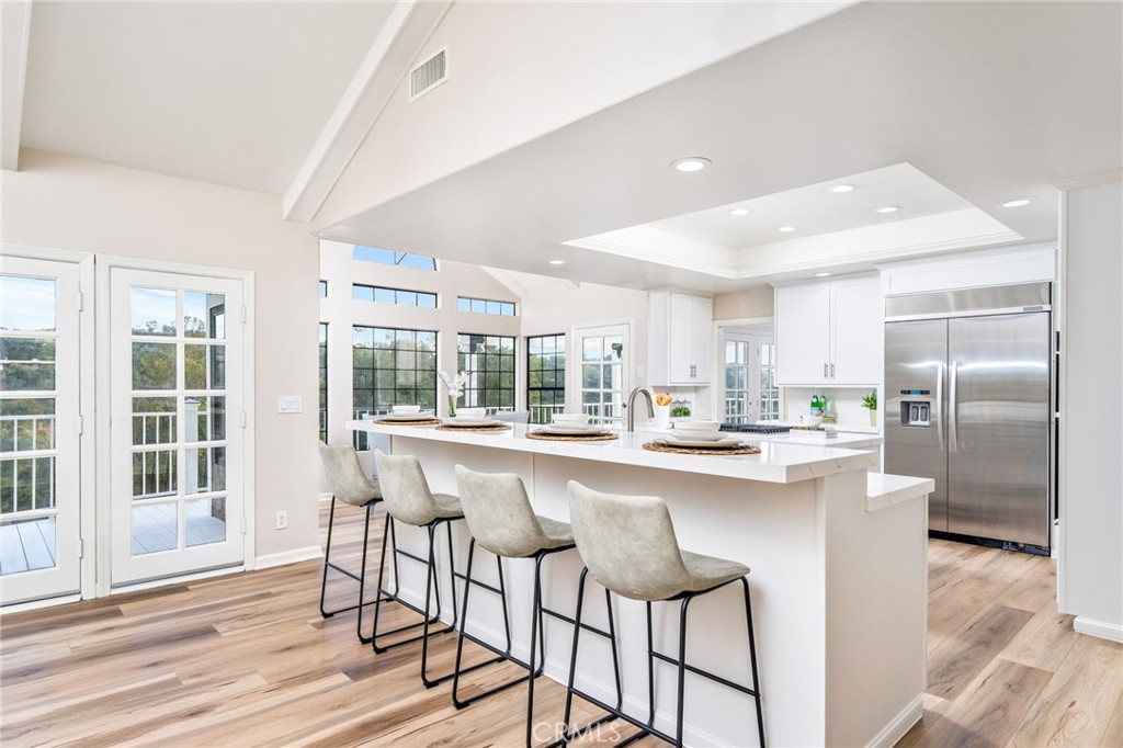1187 Edinburgh Road San Dimas, CA 91773 - Photo 11 of 57 a kitchen with stainless steel appliances granite countertop a sink and a refrigerator