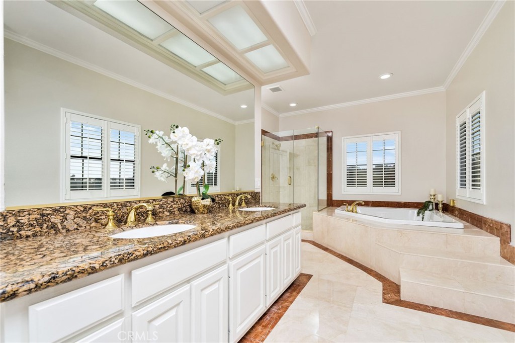 1187 Edinburgh Road San Dimas, CA 91773 - Photo 25 of 57 a spacious bathroom with sinks mirror and a bathtub