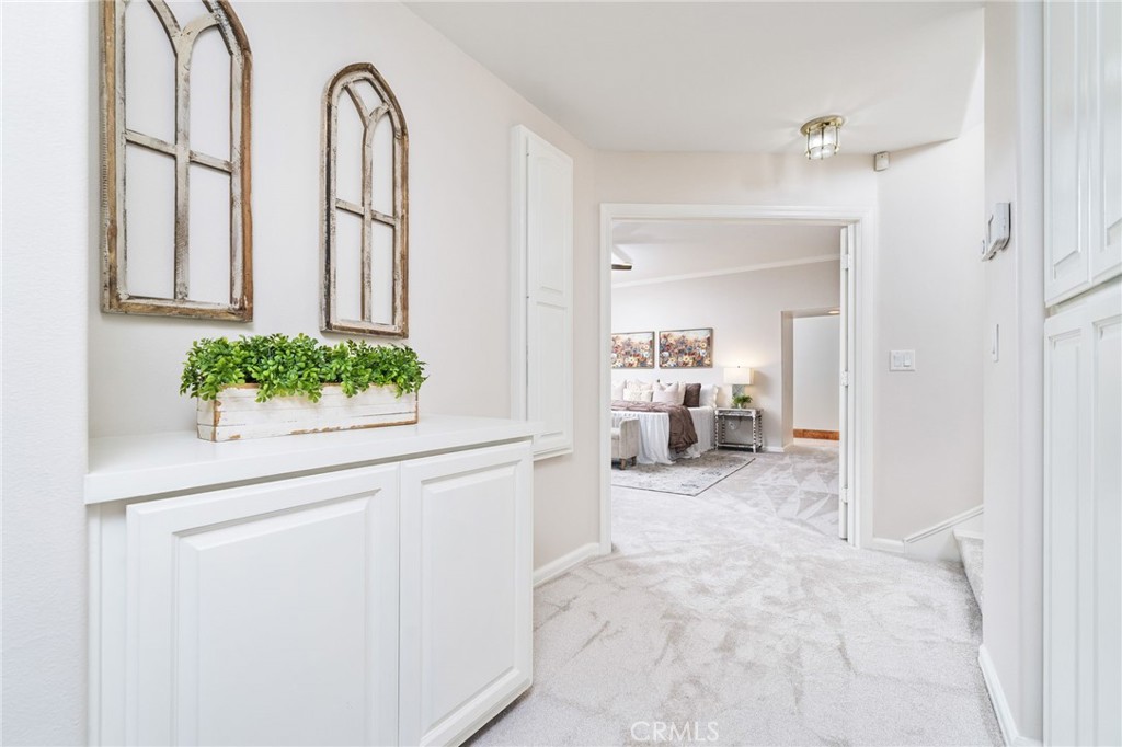 1187 Edinburgh Road San Dimas, CA 91773 - Photo 26 of 57 a view of a hallway with furniture and a window