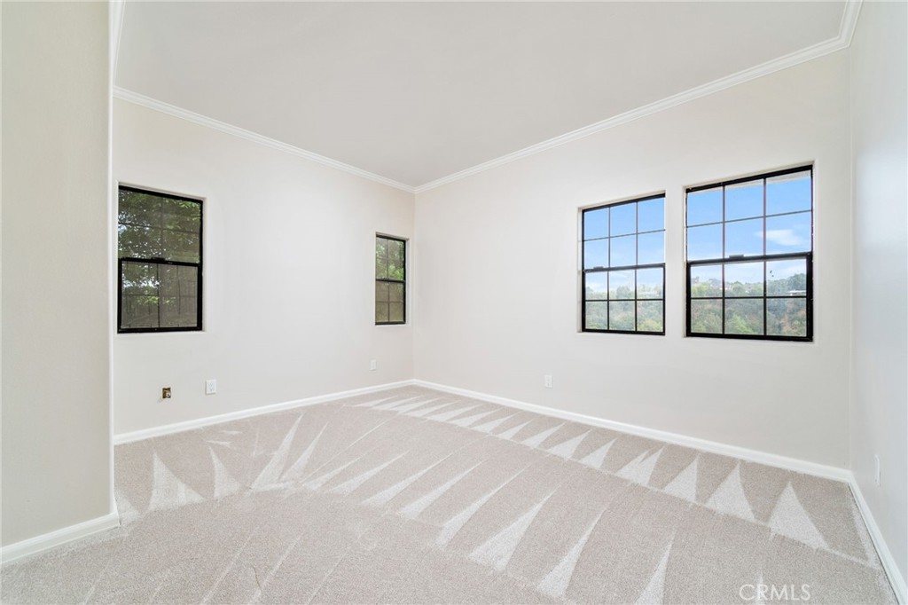 1187 Edinburgh Road San Dimas, CA 91773 - Photo 28 of 57 a view of an empty room with a window