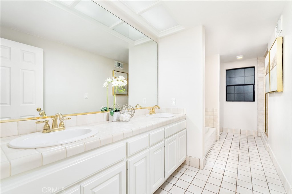 1187 Edinburgh Road San Dimas, CA 91773 - Photo 29 of 57 a bathroom with a sink and a mirror