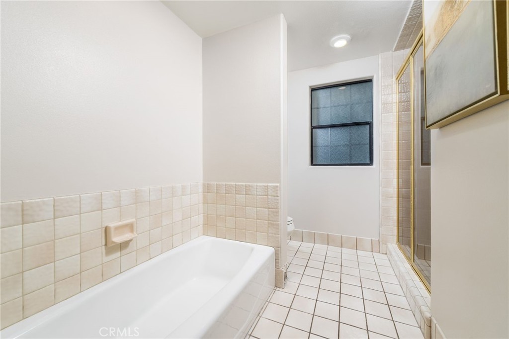 1187 Edinburgh Road San Dimas, CA 91773 - Photo 30 of 57 a bathroom with a bathtub and shower