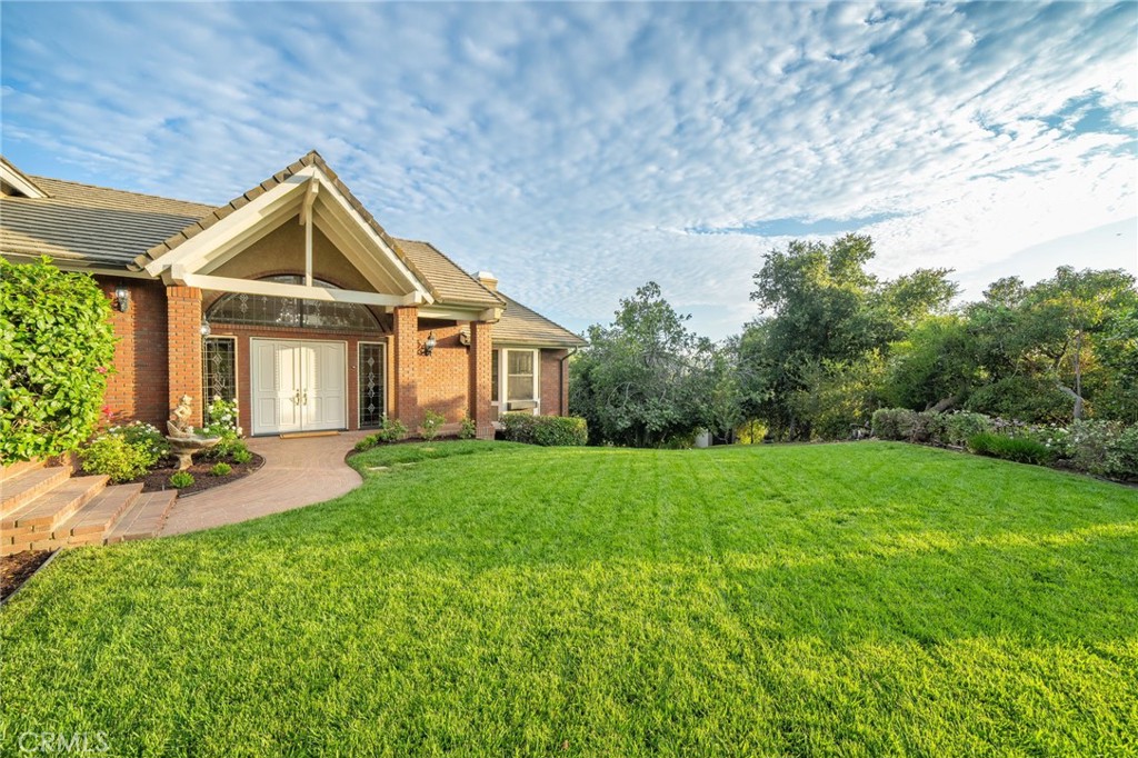 1187 Edinburgh Road San Dimas, CA 91773 - Photo 3 of 57 a front view of a house with yard and green space