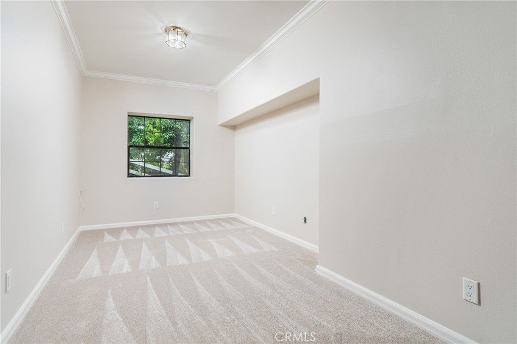 1187 Edinburgh Road San Dimas, CA 91773 - Photo 33 of 57 a view of an empty room with a window