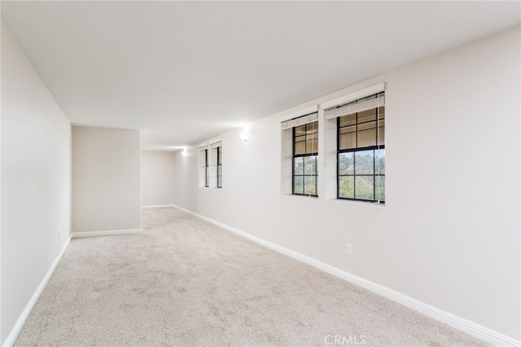 1187 Edinburgh Road San Dimas, CA 91773 - Photo 35 of 57 an empty room with windows