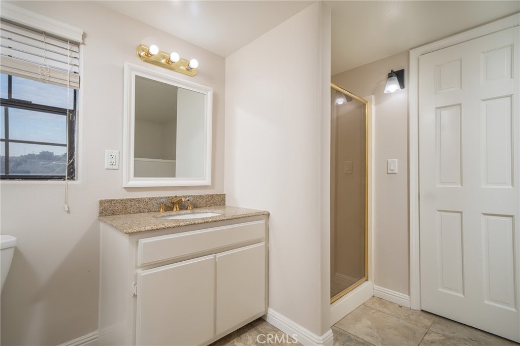 1187 Edinburgh Road San Dimas, CA 91773 - Photo 36 of 57 a bathroom with a sink toilet and mirror