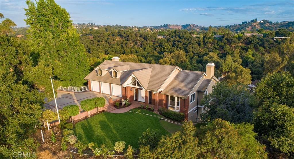 1187 Edinburgh Road San Dimas, CA 91773 - Photo 4 of 57 an aerial view of a house with a garden