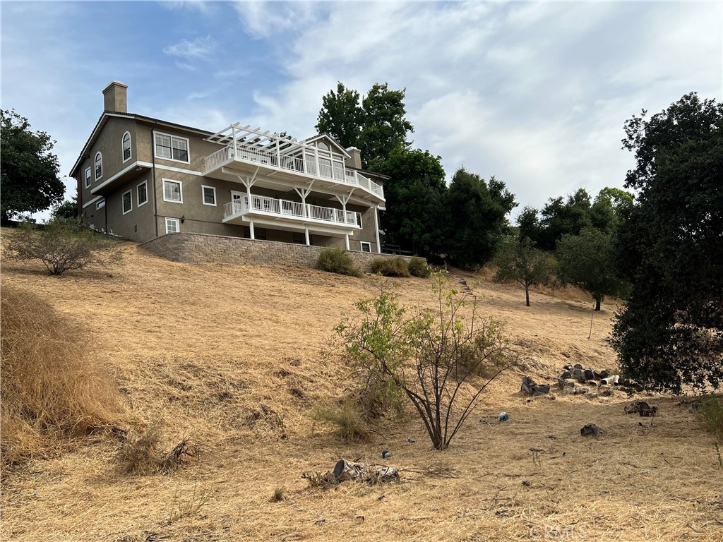 1187 Edinburgh Road San Dimas, CA 91773 - Photo 45 of 57 a view of a house with a yard covered in snow