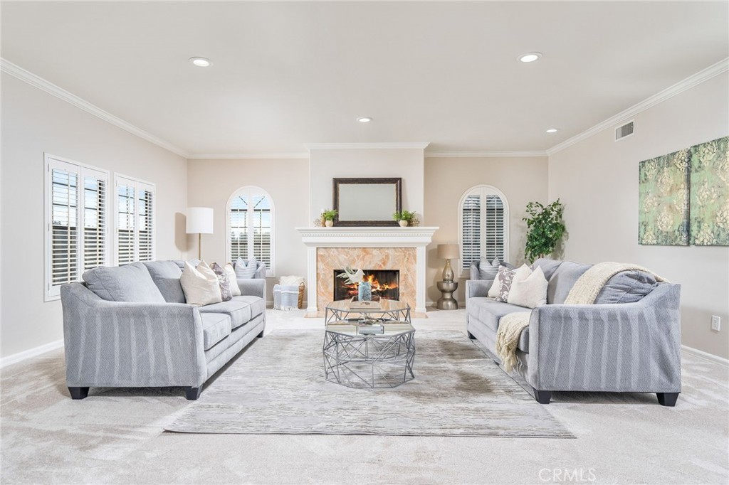 1187 Edinburgh Road San Dimas, CA 91773 - Photo 7 of 57 a living room with furniture large window and a fireplace