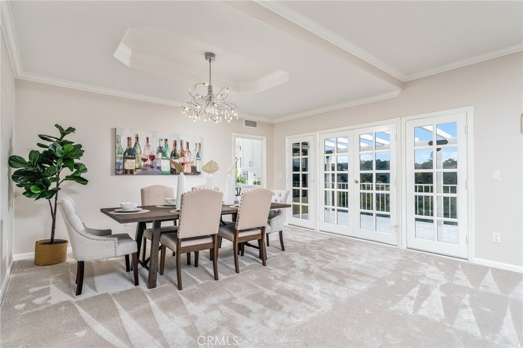 1187 Edinburgh Road San Dimas, CA 91773 - Photo 8 of 57 a dining room with furniture potted plants and a chandelier