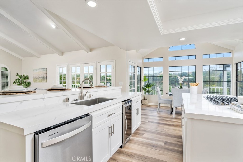 1187 Edinburgh Road San Dimas, CA 91773 - Photo 10 of 57 a large white kitchen with a large window