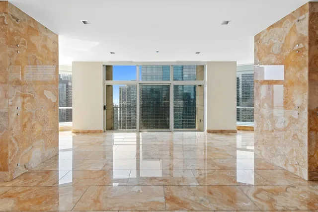 a view of a living room with a large window