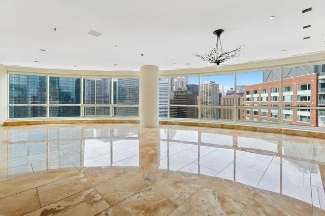 a room with a fireplace and a flat screen tv