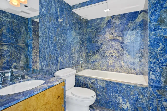 a view of a balcony with a floor to ceiling window and stairs