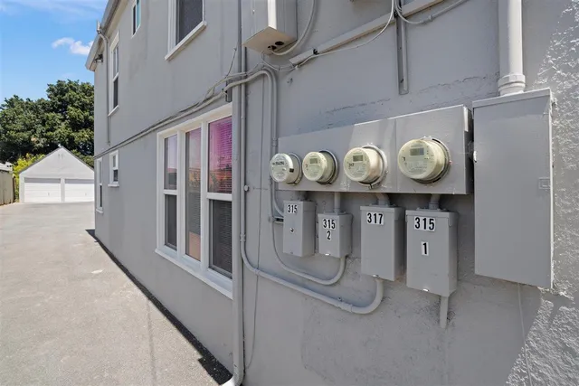 a front view of a house with outdoor seating