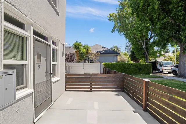 a view of backyard with seating space