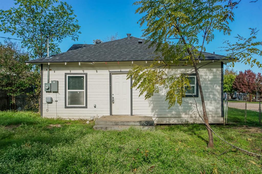 2402 Summer Avenue Waco, TX 76708 - Photo 2 of 15 White exterior siding with dark trim accents