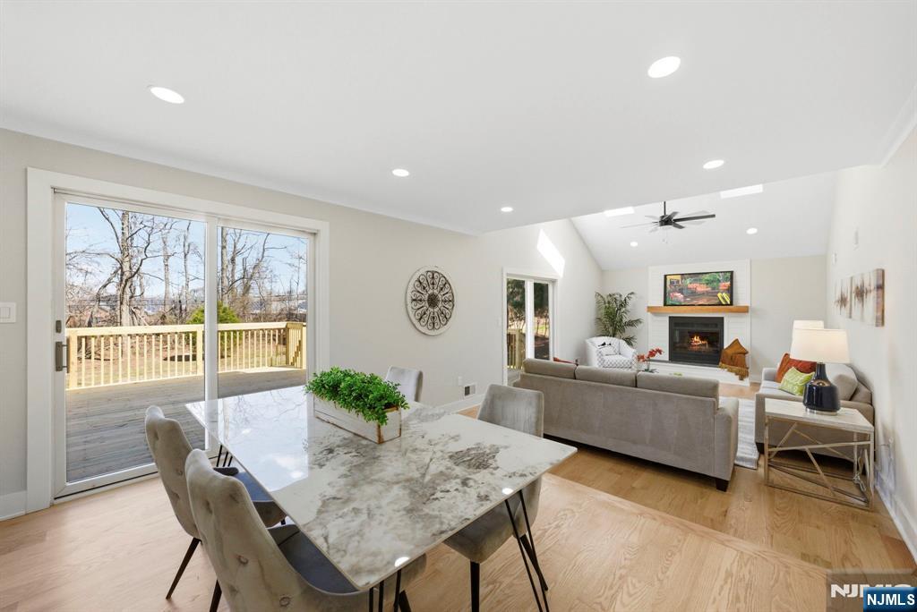 34 Knob Hill Road Morganville, NJ 07751 - Photo 21 of 50 a living room with furniture a large window and a table