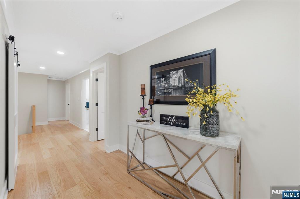 34 Knob Hill Road Morganville, NJ 07751 - Photo 31 of 50 a living room with furniture and a potted plant