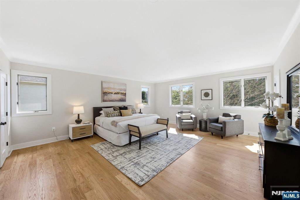 34 Knob Hill Road Morganville, NJ 07751 - Photo 33 of 50 a living room with furniture and a flat screen tv