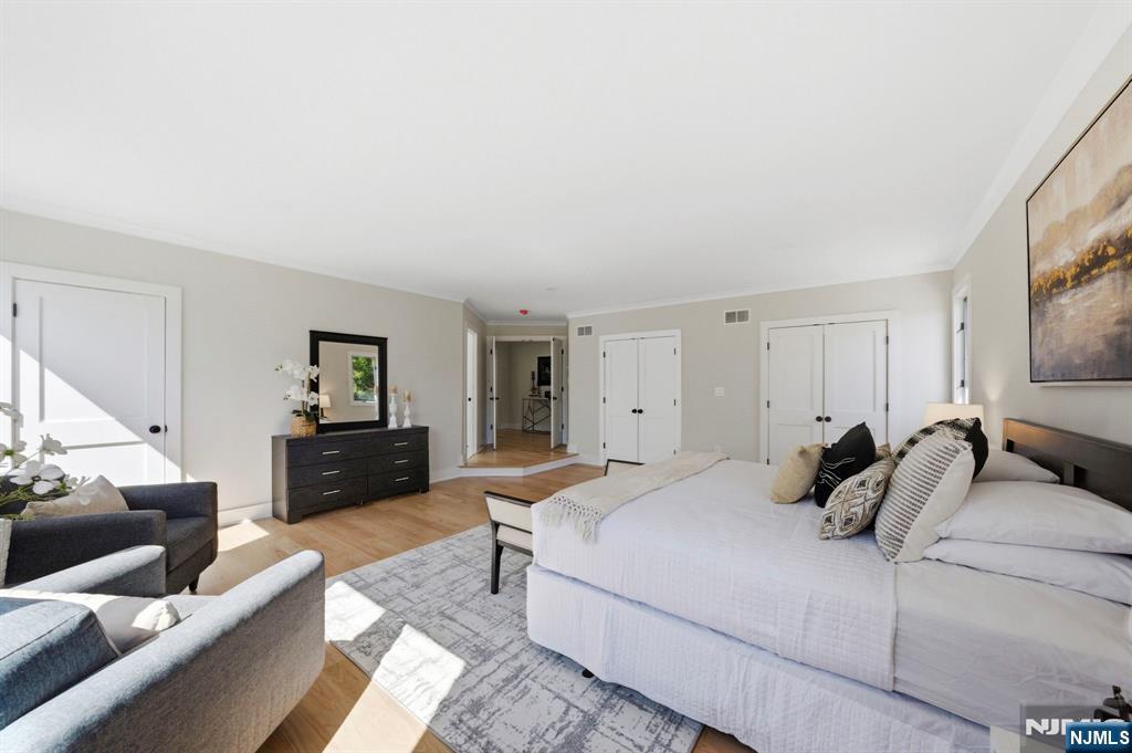 34 Knob Hill Road Morganville, NJ 07751 - Photo 35 of 50 a bedroom with a bed and a couch