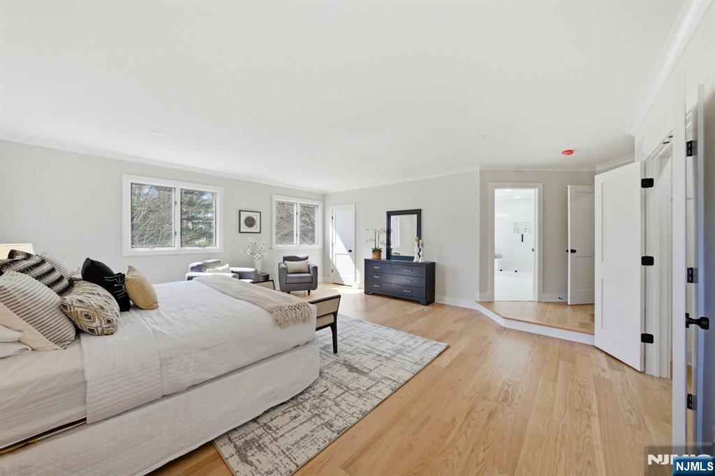 34 Knob Hill Road Morganville, NJ 07751 - Photo 36 of 50 a bedroom with a bed and a couch