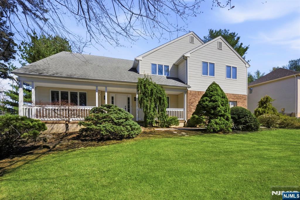 34 Knob Hill Road Morganville, NJ 07751 - Photo 4 of 50 a front view of a house with a yard