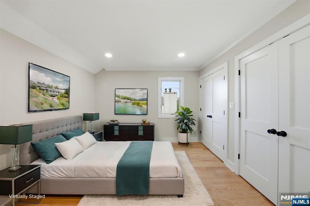 34 Knob Hill Road Morganville, NJ 07751 - Photo 41 of 50 a bedroom with a bed and painting on the wall