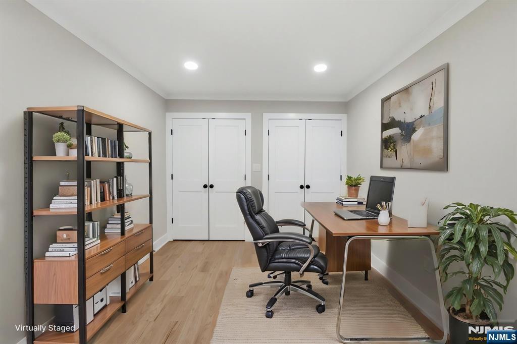 34 Knob Hill Road Morganville, NJ 07751 - Photo 43 of 50 a workspace with furniture and book shelf
