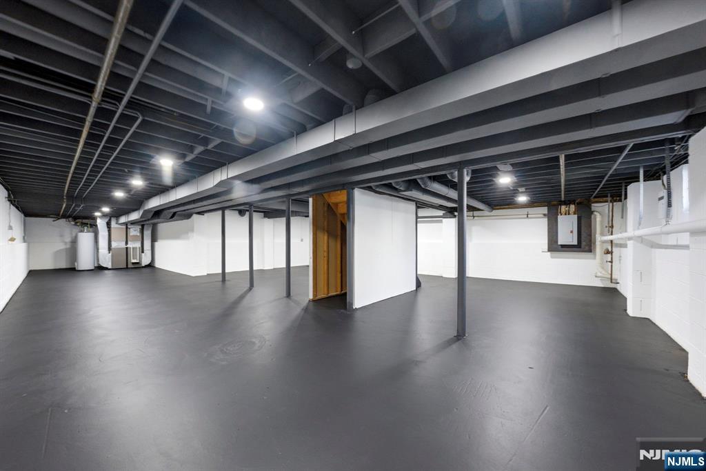 34 Knob Hill Road Morganville, NJ 07751 - Photo 46 of 50 a view of water heater with wooden floor