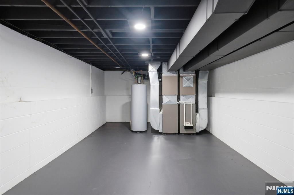 34 Knob Hill Road Morganville, NJ 07751 - Photo 48 of 50 a view of an empty room with wooden floor and a window