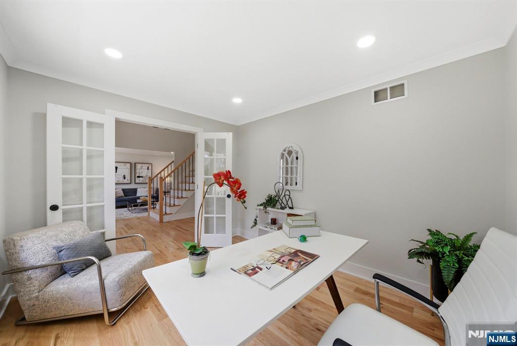 34 Knob Hill Road Morganville, NJ 07751 - Photo 8 of 50 a living room with furniture and flowers