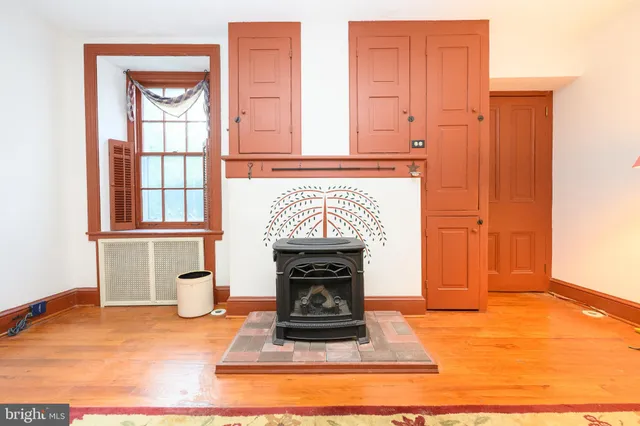 a view of a livingroom with furniture and a kitchen