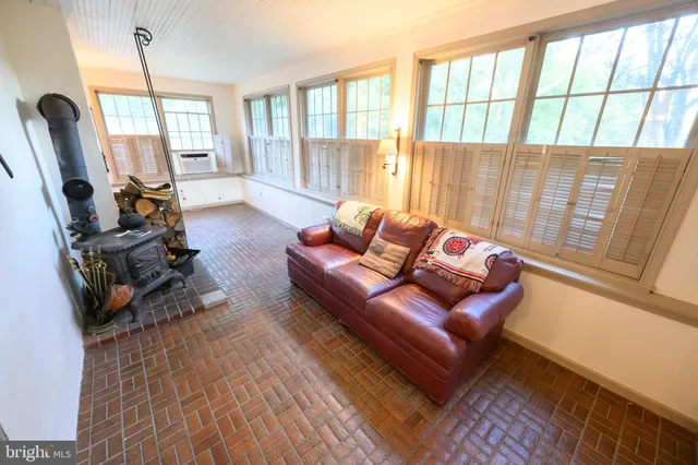 a kitchen with stainless steel appliances granite countertop a refrigerator a stove and a sink