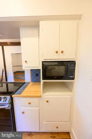 a bedroom with a bed and a table in it