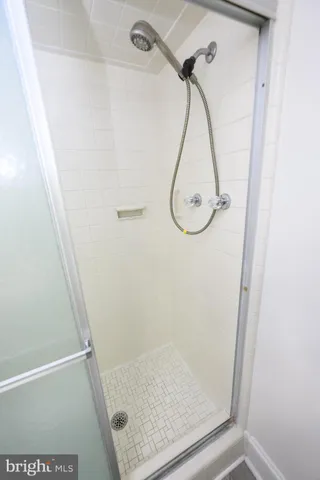 a bedroom with a bed with window