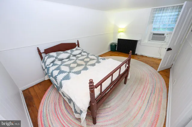 a view of backyard of house with green space