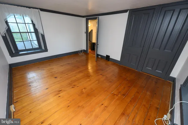 a view of a backyard with large trees